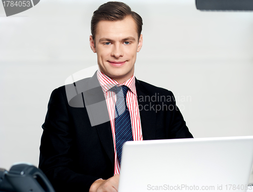 Image of Businessman working on laptop