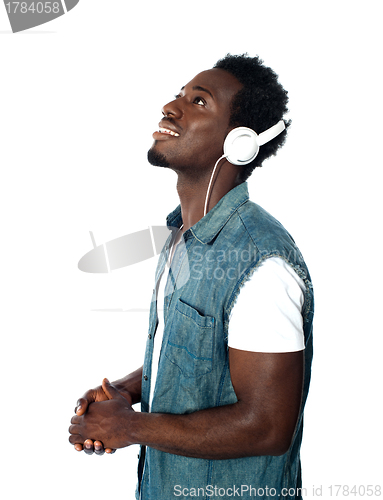 Image of African guy lost in musical world