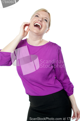 Image of Young businesswoman enjoying herself