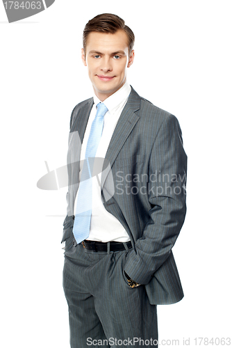 Image of Smiling entrepreneur posing with hands in pocket