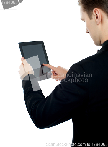 Image of Man operating electronic digital device