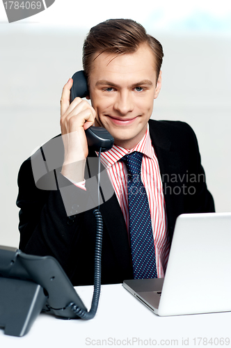 Image of Smart businessman communicating on phone