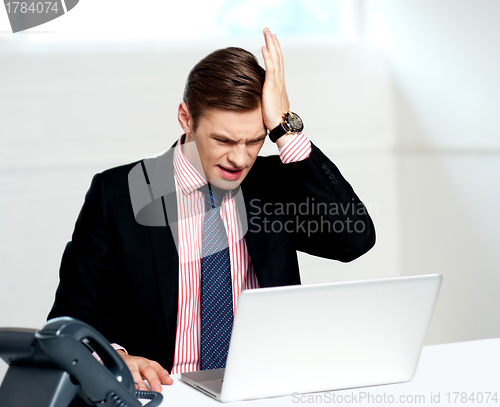 Image of Unhappy businessperson. Business loss