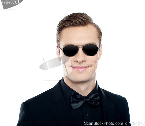 Image of Trendy young male model wearing goggles