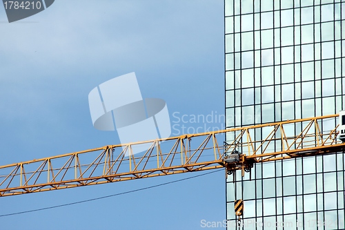Image of a crane and a modern building