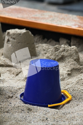 Image of sandpit toy and sand cake