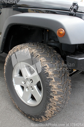 Image of dirty offroad car tire