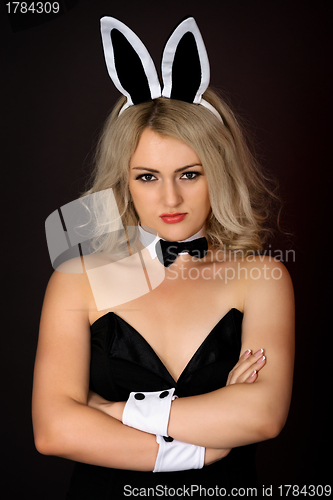 Image of Sullen girl in sexy bunny costume