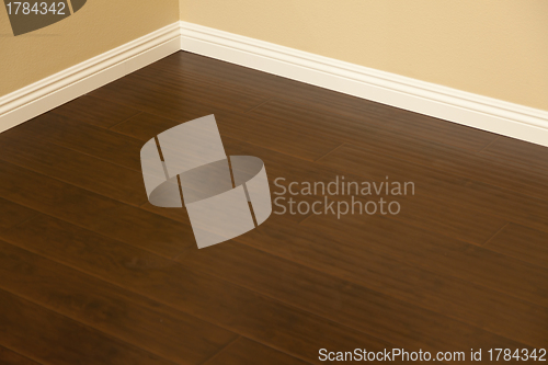 Image of Newly Installed Brown Laminate Flooring and Baseboards in Home