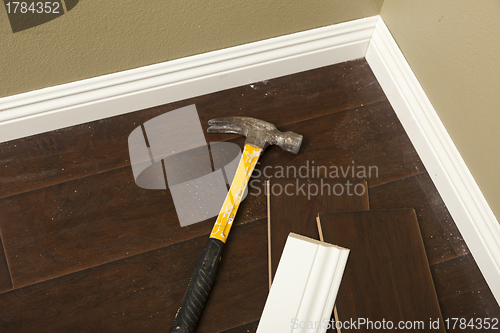 Image of Hammer, Laminate Flooring and New Baseboard Molding