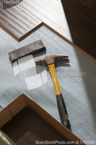 Image of Hammer and Block with New Laminate Flooring
