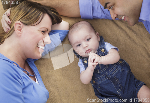 Image of Mixed Race Family Playing on the Blanket