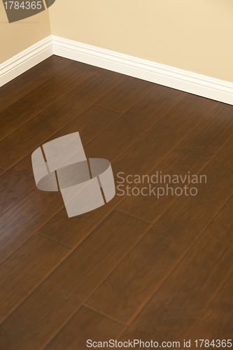 Image of Newly Installed Brown Laminate Flooring and Baseboards in Home