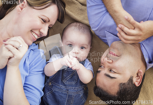 Image of Mixed Race Family Playing on the Blanket