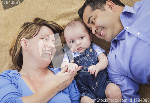 Image of Mixed Race Family Playing on the Blanket