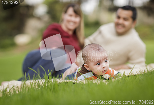 Image of Happy Mixed Race Baby Boy and Parents Playing in Park