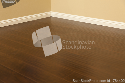 Image of Newly Installed Brown Laminate Flooring and Baseboards in Home