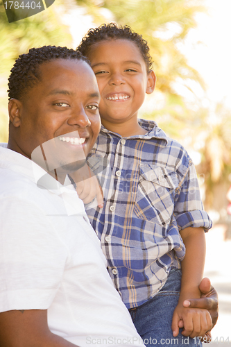 Image of Happy Mixed Race Father and Son Playing