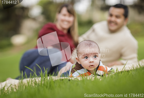 Image of Happy Mixed Race Baby Boy and Parents Playing in Park