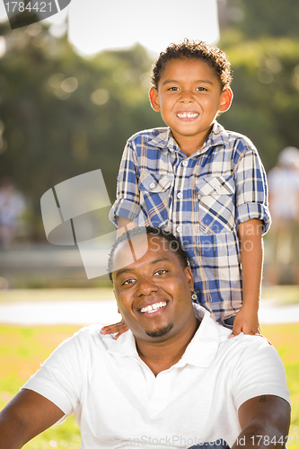 Image of Happy Mixed Race Father and Son Playing