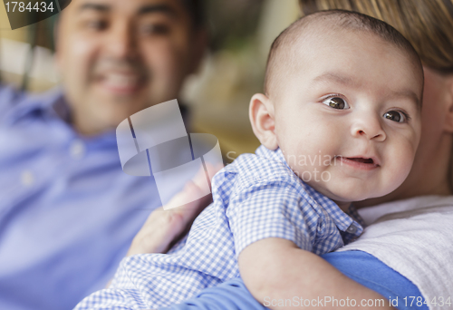 Image of Happy Attractive Mixed Race Couple Burping Their Son