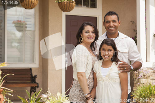 Image of Small Hispanic Family in Front of Their Home
