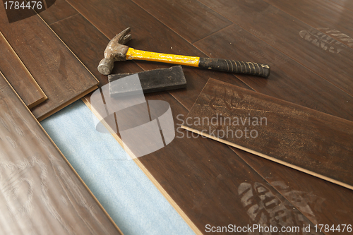 Image of Hammer and Block with New Laminate Flooring