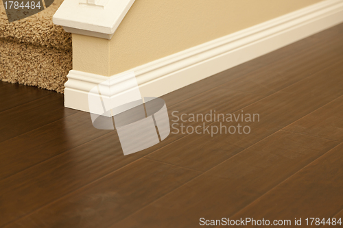 Image of Newly Installed Brown Laminate Flooring and Baseboards in Home