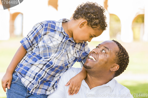 Image of Happy Mixed Race Father and Son Playing