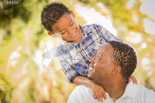 Image of Happy Mixed Race Father and Son Playing