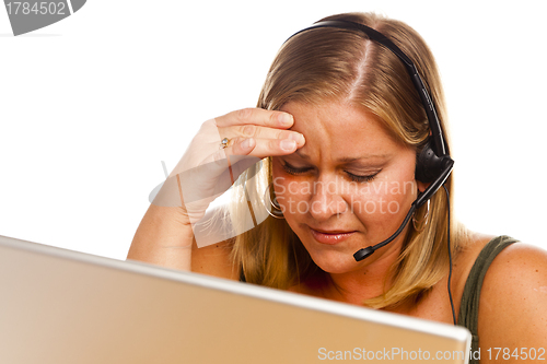 Image of Businesswoman with Phone Headset and Headache