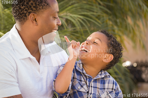 Image of Happy Mixed Race Father and Son Playing