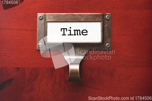 Image of Lustrous Wooden Cabinet with Time File Label