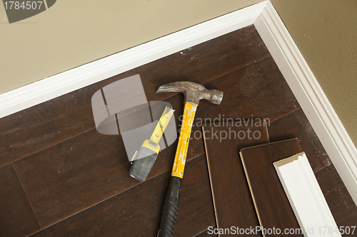 Image of Hammer, Laminate Flooring and New Baseboard Molding