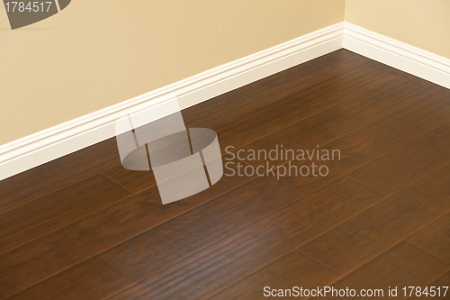 Image of Newly Installed Brown Laminate Flooring and Baseboards in Home