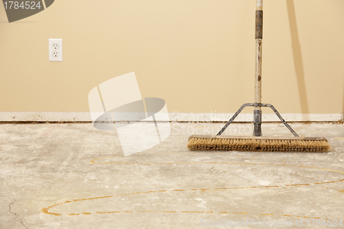 Image of Concrete House Floor with Broom Ready for Flooring Installation