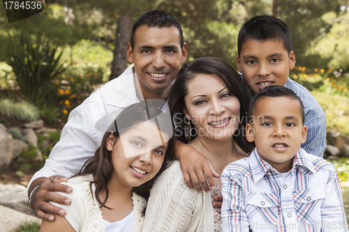 Image of Happy Attractive Hispanic Family Portrait In the Park