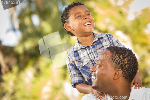 Image of Happy Mixed Race Father and Son Playing