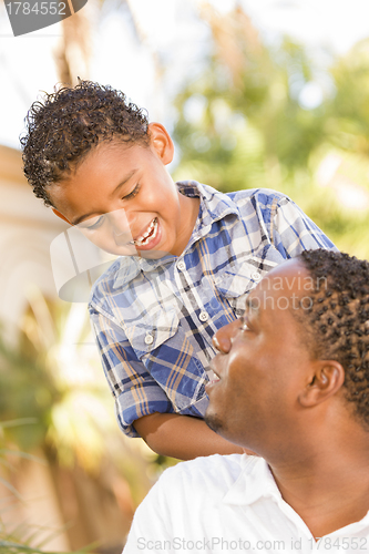 Image of Happy Mixed Race Father and Son Playing