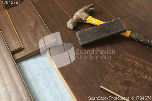 Image of Hammer and Block with New Laminate Flooring