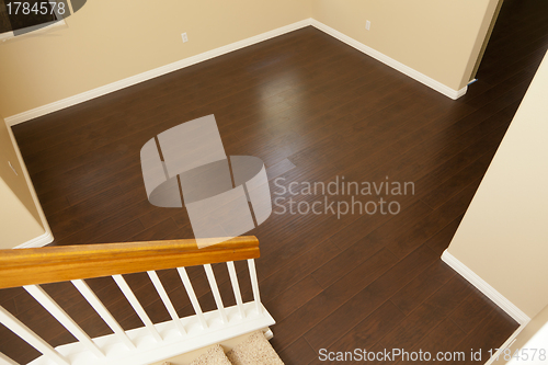 Image of Newly Installed Brown Laminate Flooring and Baseboards in Home