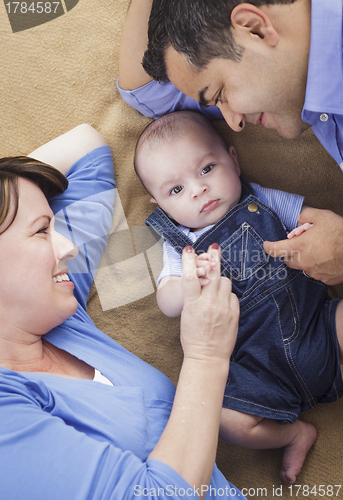 Image of Mixed Race Family Playing on the Blanket