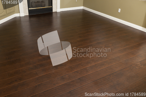 Image of Newly Installed Brown Laminate Flooring and Baseboards in Home