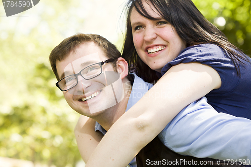 Image of Young Couple Having Fun in the Park