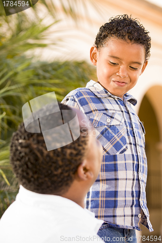 Image of Happy Mixed Race Father and Son Playing