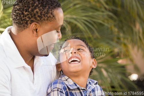 Image of Happy Mixed Race Father and Son Playing