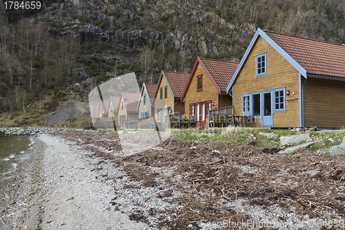 Image of small holiday homes at coastline in norway