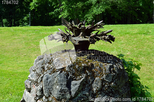 Image of vintage retro fountain steel flower mossy stones 