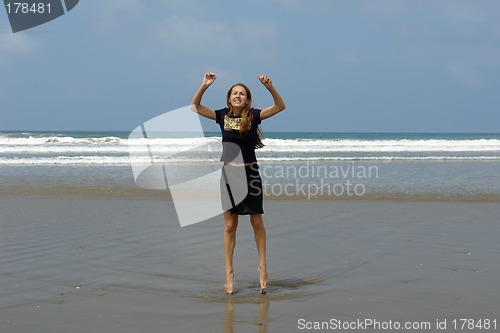 Image of jumping girl on the beach