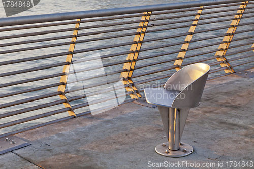 Image of metal chair at waterfornt